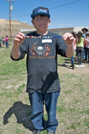 Student Tristan holds up his water molecule's journey