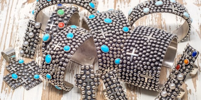 Ronnie Willie's work is best known for the repousse style seen here. The display is from Pickle Barrel Trading Post in Globe, Az.